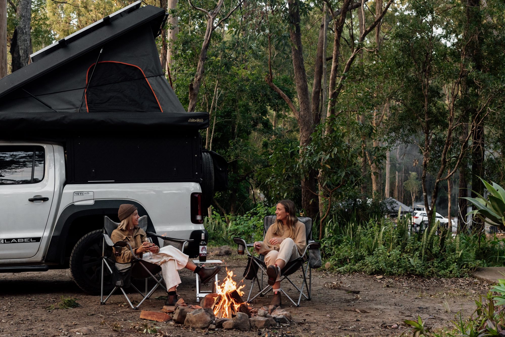 Guests unwinding together by the fire